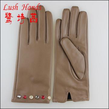 With diamonds decorated women fashion leather gloves