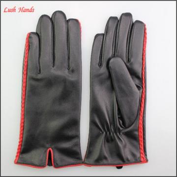 Female black leather gloves with special design at margin