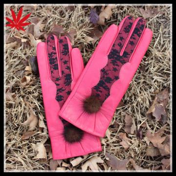 Fashion pink leather gloves with lace and ball design