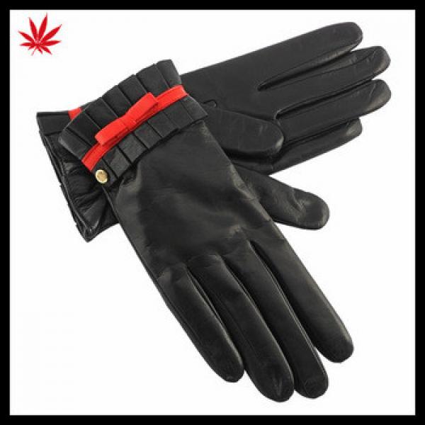 ladies sheepskin dubai importer leather gloves with red bow and flod side #1 image