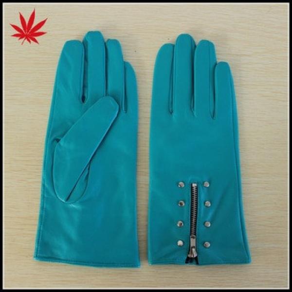 Women wear sky blue leather gloves with zipper and studs #1 image