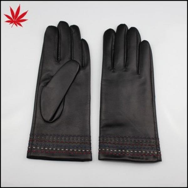 Black leather gloves with many special design stichings at the bottom #1 image