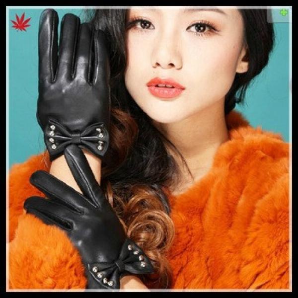 short fingered leather glove with big bow and studs for ladies in black #1 image
